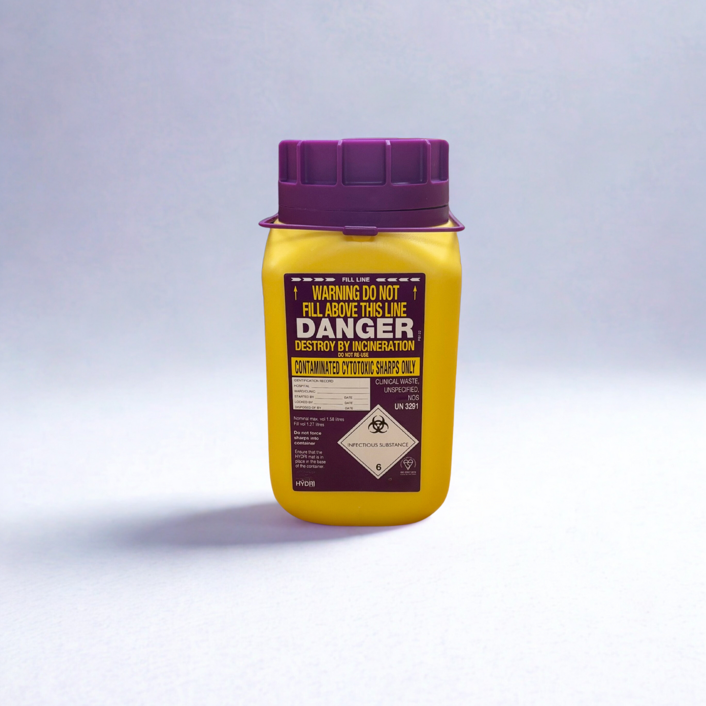 Yellow container with purple lid on a white background